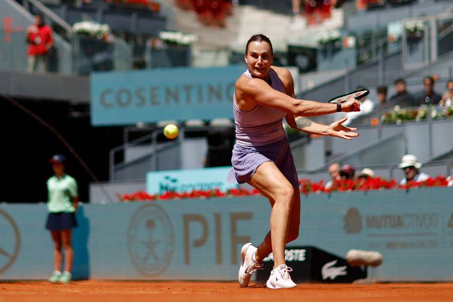 Aryna Sabalenka returns a ball to Anna Blinkova