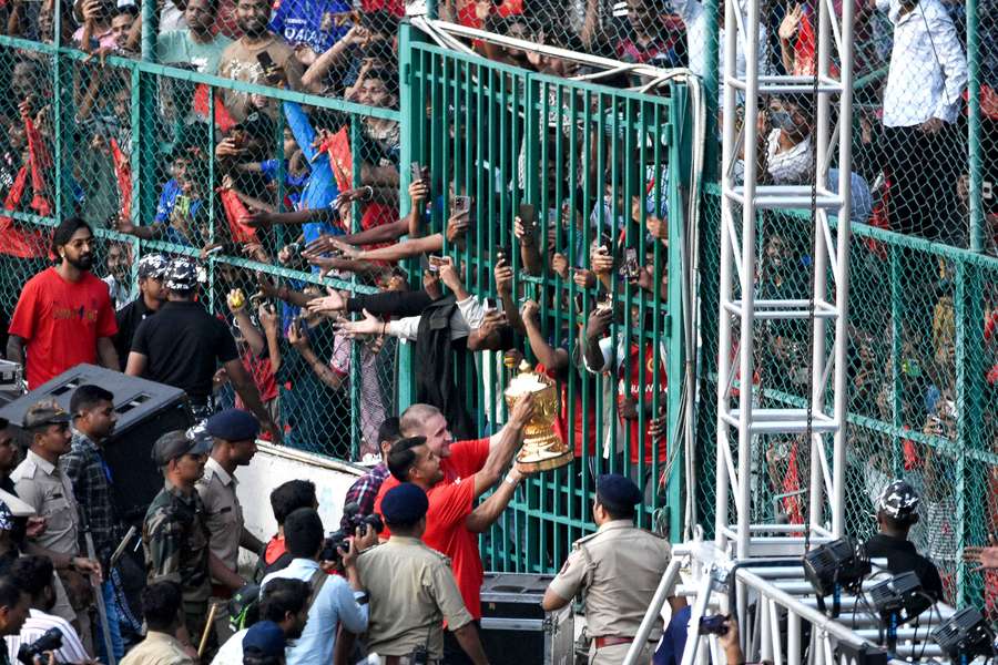 Players carry the IPL trophy during celebrations at the M. Chinnaswamy Stadium on Wednesday Players carry the IPL trophy during celebrations at the M. Chinnaswamy Stadium on Wednesday