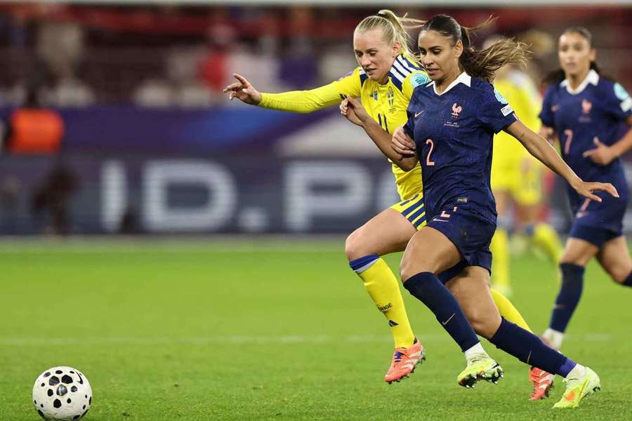 Sweden's Stina Blackstenius and France's Maelle Lakrar fight for possession Sweden's Stina Blackstenius and France's Maelle Lakrar fight for possession