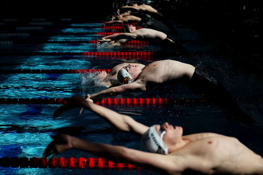 Athletes compete in the Men's 50 Meter Backstroke heats on Day 2 of the TYR Pro Swim Series Westmont on April 13