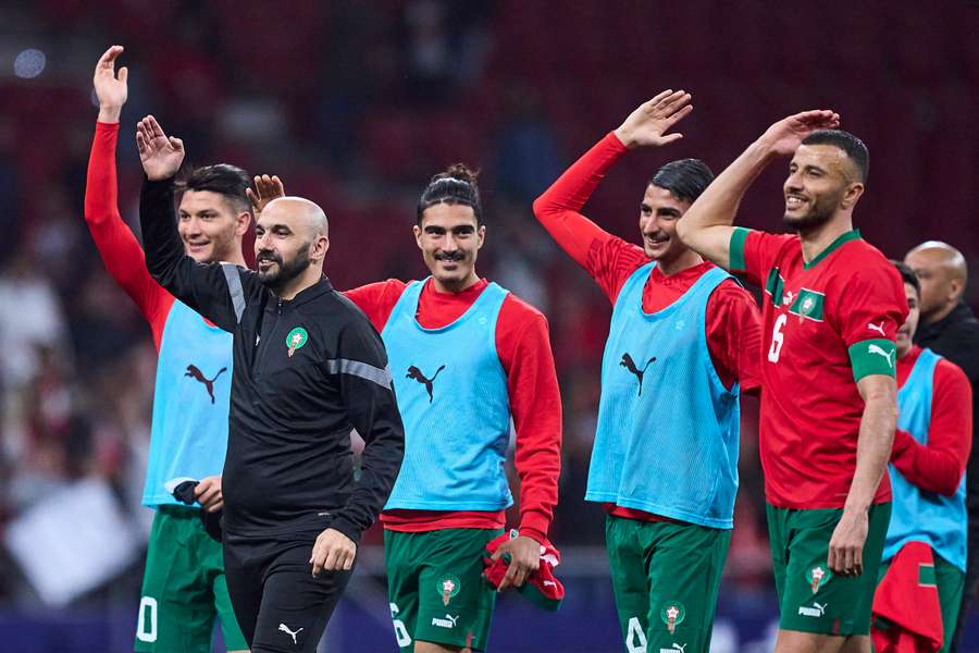 Morocco coach Walid Regragui and players wave to the fans after the international friendly against Peru earlier this year