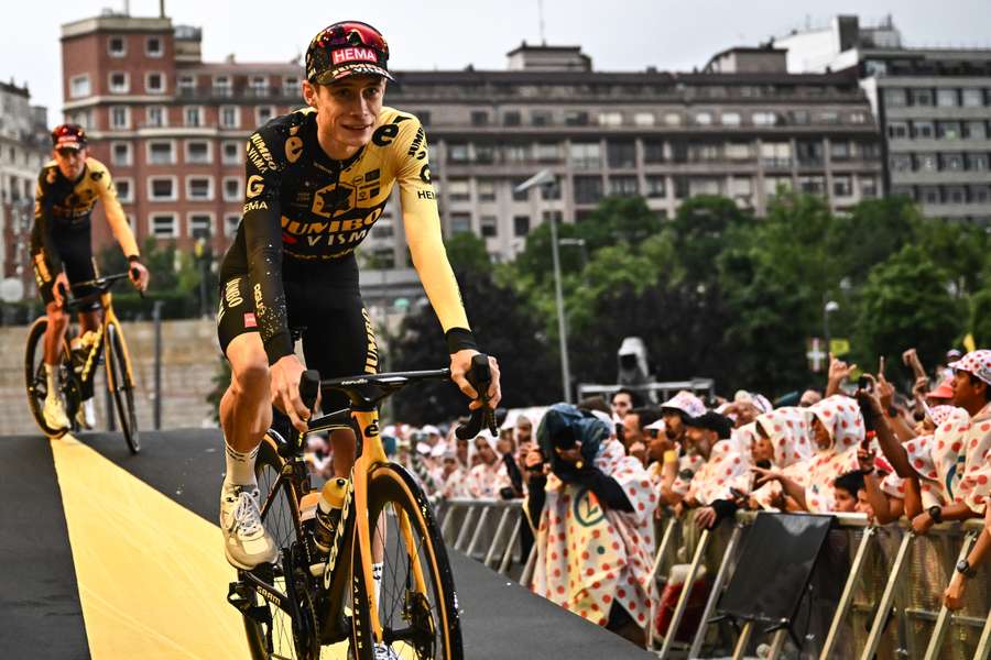 Jumbo-Visma's Danish rider Jonas Vingegaard cycles to the stage during the official teams presentation