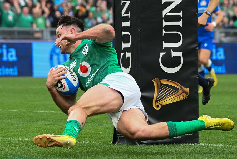 Ireland's full-back Hugo Keenan scores a try during the Six Nations international rugby union match between Italy and Ireland 