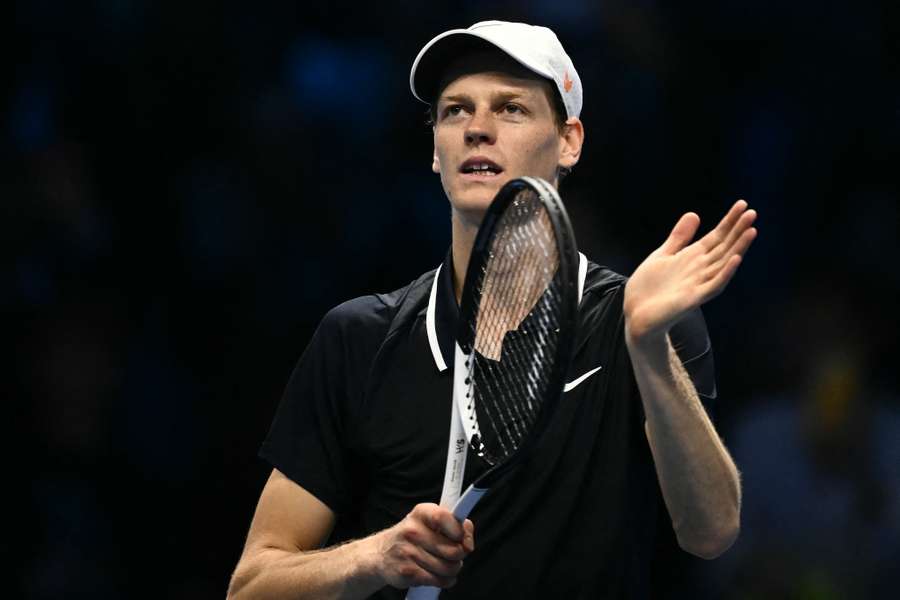 Jannik Sinner celebrates after beating Alex de Minaur at the ATP Finals in Turin on Sunday