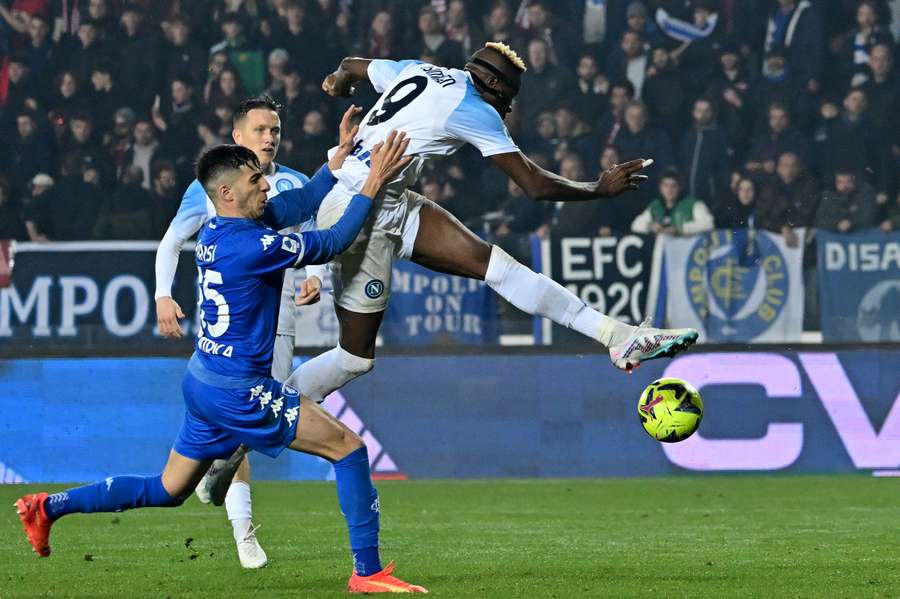 Empoli's Italian defender Fabiano Parisi and Napoli's Nigerian forward Victor Osimhen fight for the ball 