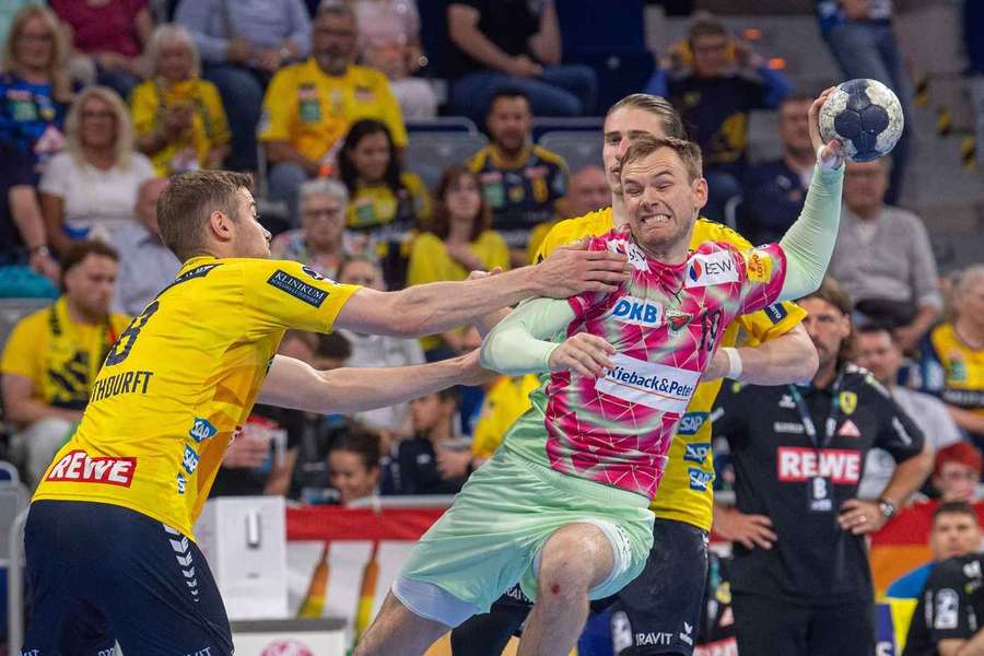 Mathias Gidsel Füchse Berlin and Juri Knorr Rhein-Neckar Löwen, battle for the ball