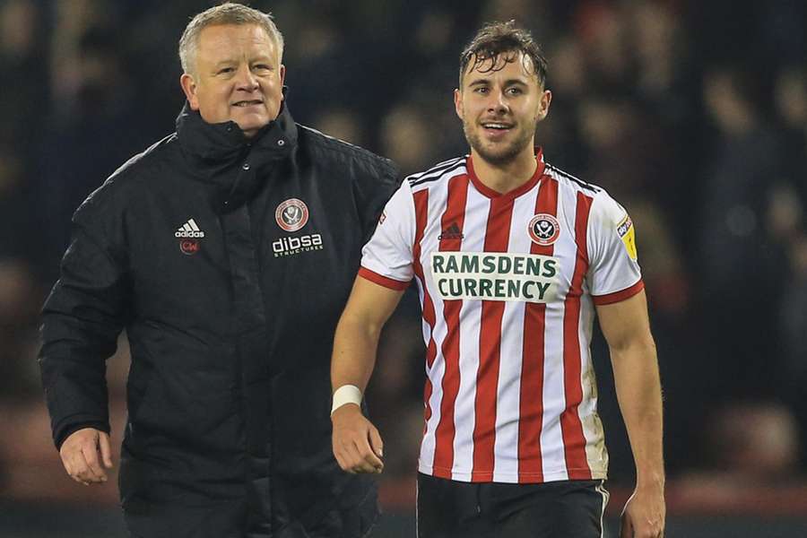 Chris Wilder (left) with George Baldock after Sheffield United's Boxing Day victory over Derby in 2018