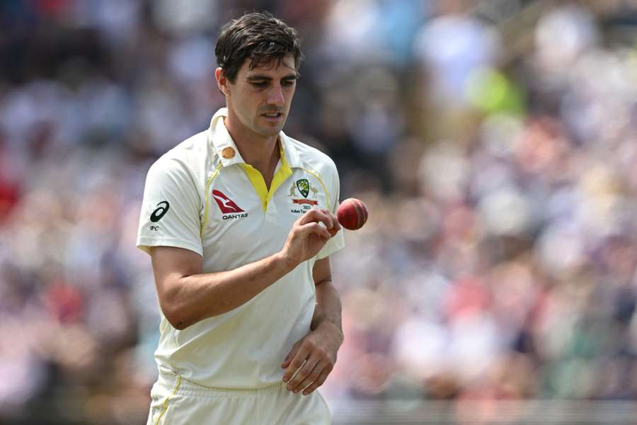 Australia's Pat Cummins prepares to bowl on day four