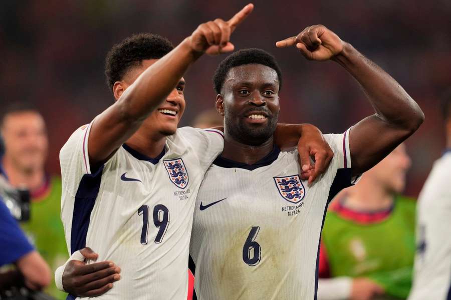 Two of England's Euro 2024 heroes Ollie Watkins and Marc Guehi celebrate their semi-final victory