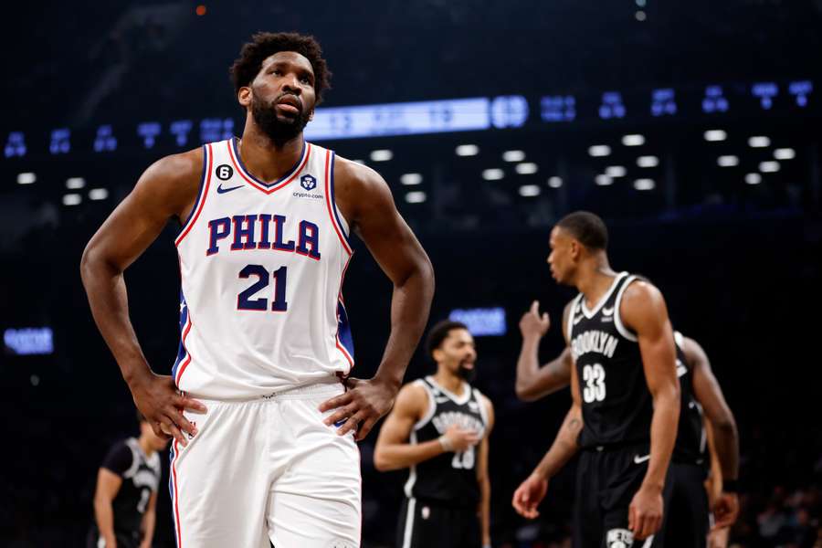 Philadelphia 76ers' Joel Embiid (L) reacts during game three of the Eastern Conference first-round play-off series against the Brooklyn Nets