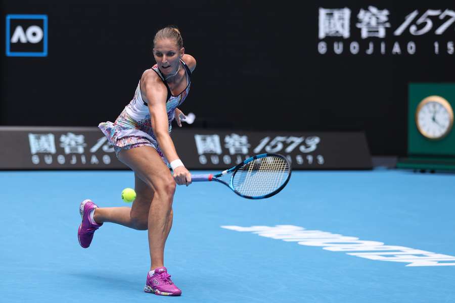 Pliskova returns the ball against Linette