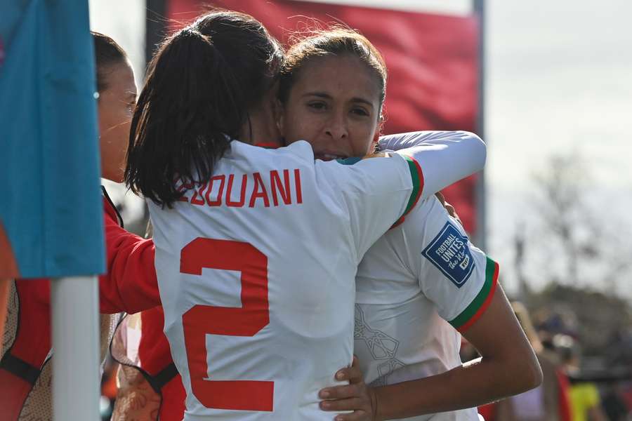 Morocco's forward #09 Ibtissam Jraidi (R) celebrates with Morocco's defender #02 Zineb Redouani