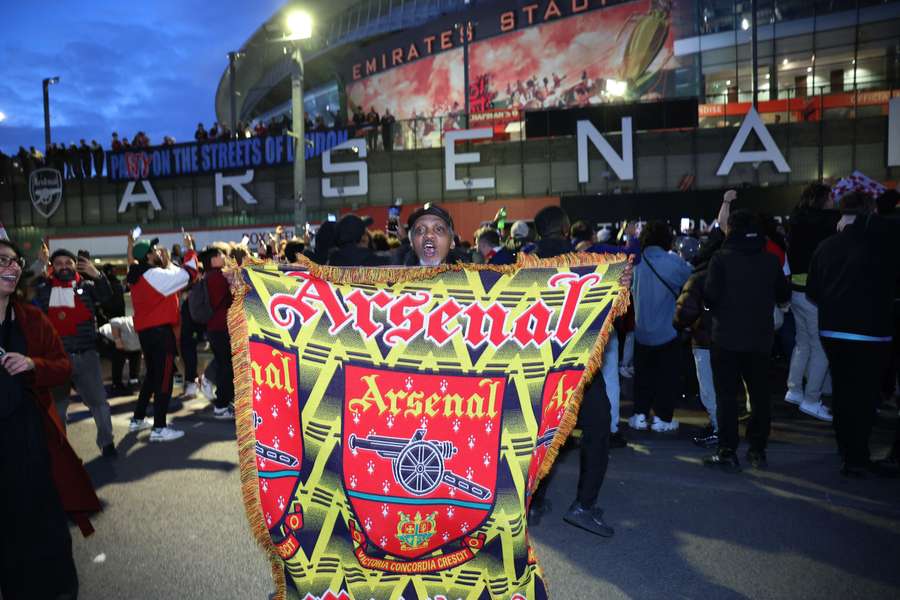 Arsenal fan celebrates winning the title