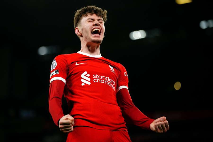 Liverpool's Conor Bradley celebrates after assisting their side's third goal