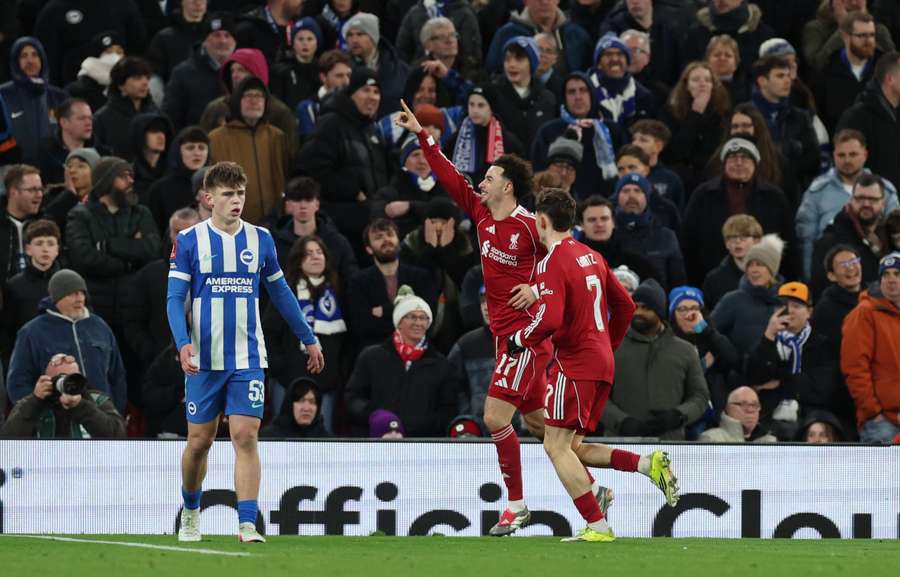 Liverpool's Curtis Jones celebrates scoring their first goal with Florian Wirtz