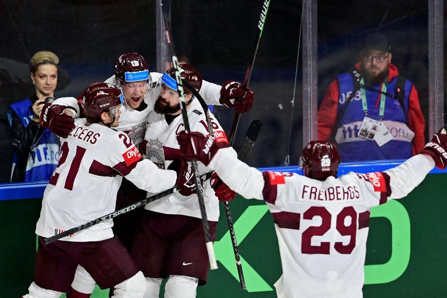 Latvia celebrate going 2-1 up