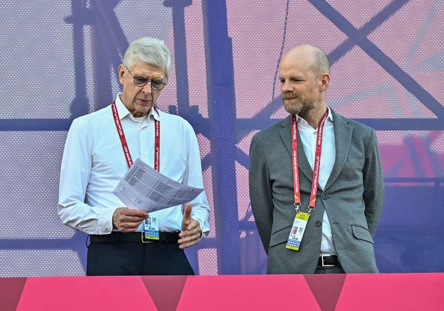 Arsene Wenger (L) with FIFA Secretary General Mattias Grafstrom Arsene Wenger (L) with FIFA Secretary General Mattias Grafstrom