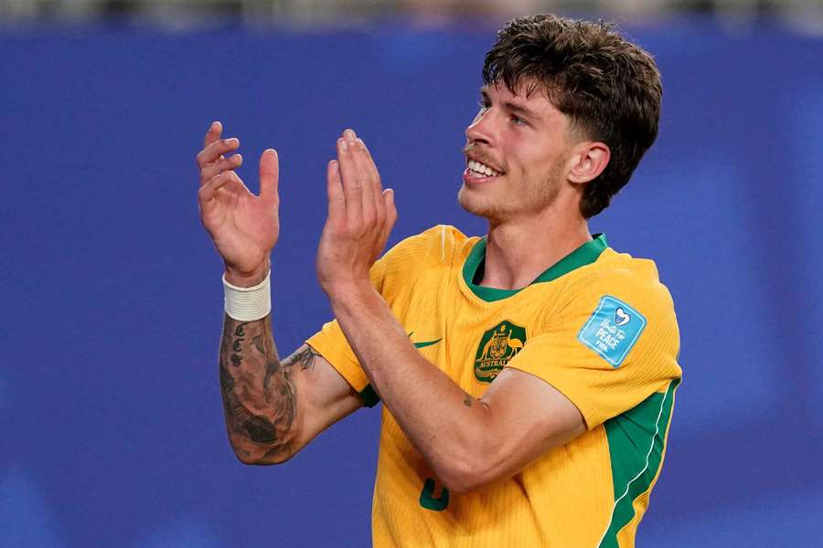 Jordy Bos applauds Australian supporters following their 1-1 draw with Paraguay.