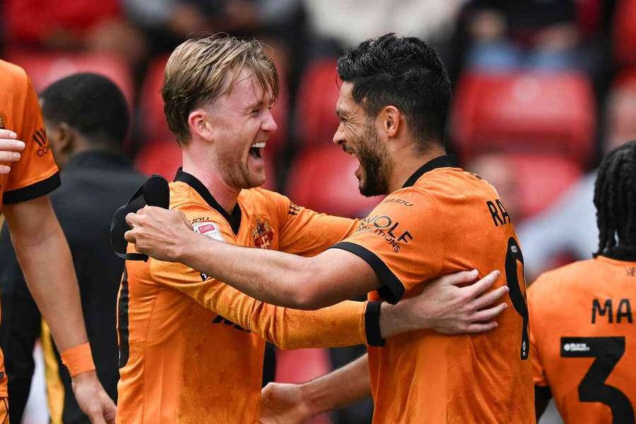 Raul Jimenez (right) celebrates with Wolves teammate Tommy Doyle