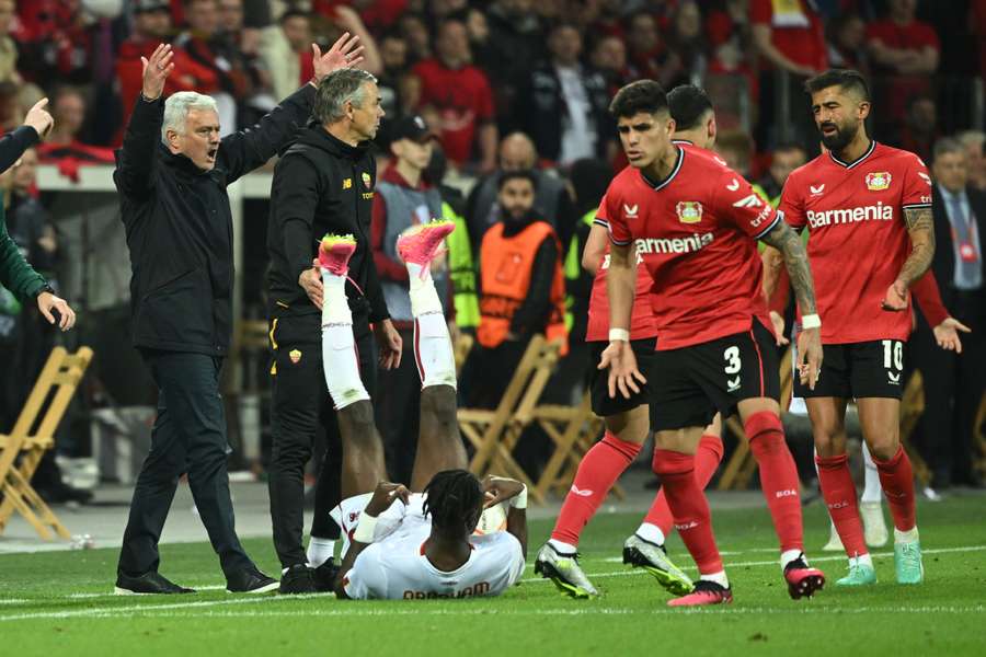 Roma coach Jose Mourinho (L) gestures during his side's Europa League semi-final second-leg against Bayer Leverkusen