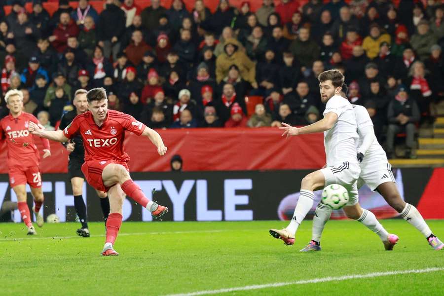 Kevin Nisbett of Aberdeen scores the opening goal