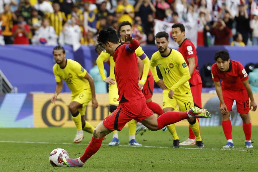 South Korea's Son Heung-Min scores their third goal from the penalty spot