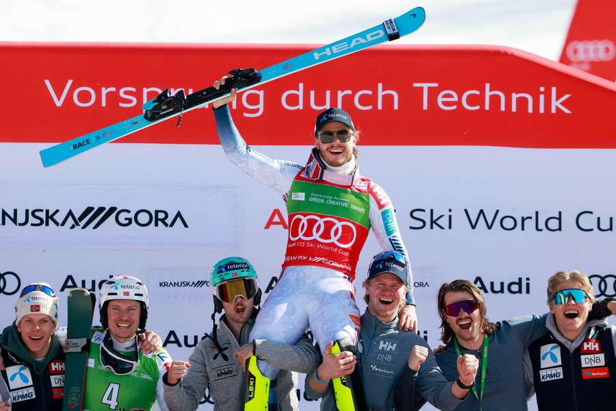 Norway's Atle Lie McGrath celebrates with his team on the podium after winning the slalom in Kranjska Gora Norway's Atle Lie McGrath celebrates with his team on the podium after winning the slalom in Kranjska Gora