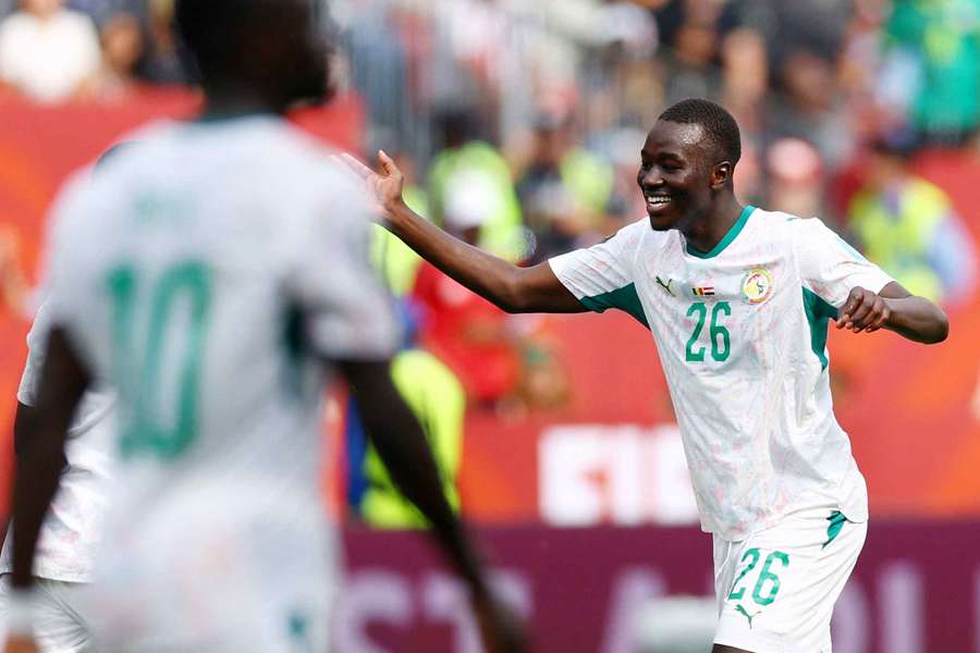 Senegal's Pape Gueye celebrates scoring their fourth goal