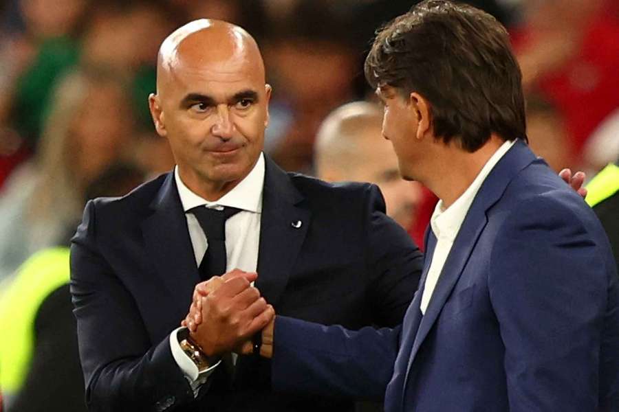 Portugal boss Roberto Martinez, left, shakes hands with Croatia coach Zlatko Dalic