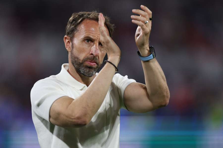 England's head coach Gareth Southgate gestures to fans
