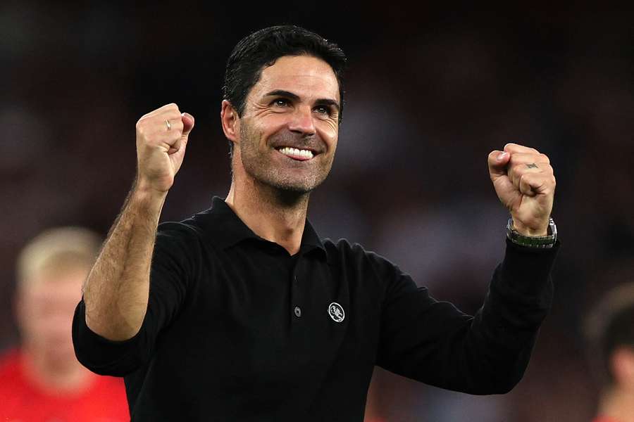 Arsenal's Spanish manager Mikel Arteta celebrates their victory on the pitch 