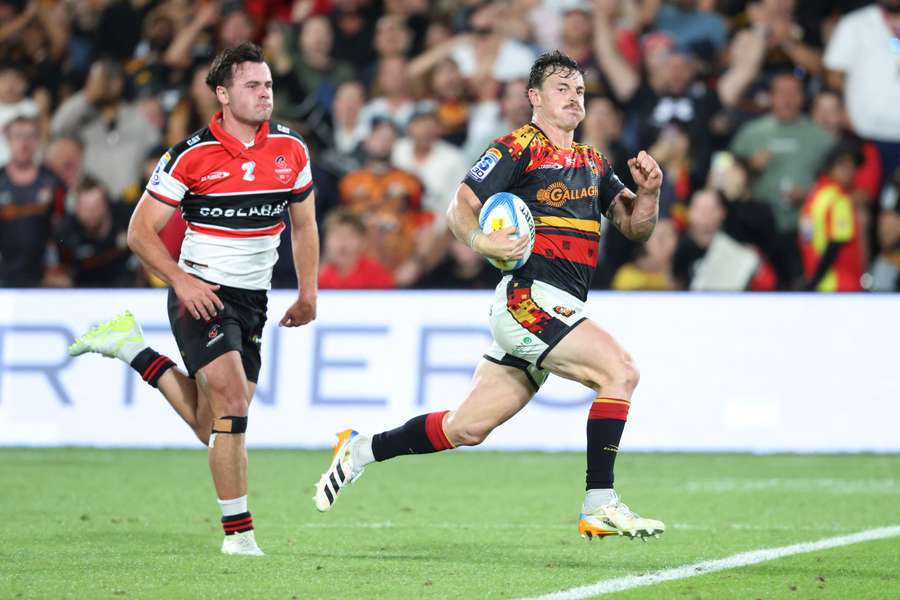 Chiefs player Leroy Carter makes a break for the line against the Crusaders in February.