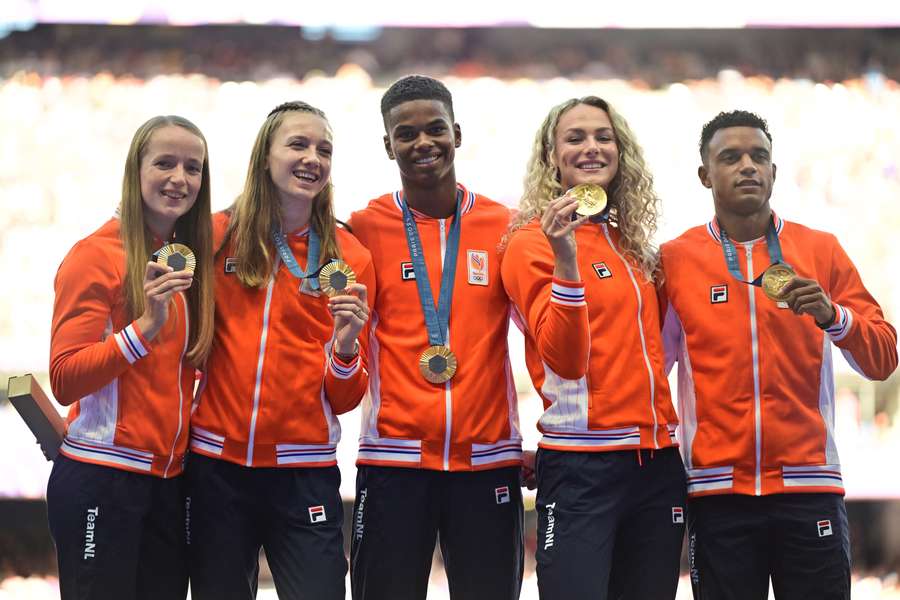Eugene Omalla (R) and the Dutch Olympic 4x400m mixed relay team with their gold medals Eugene Omalla (R) and the Dutch Olympic 4x400m mixed relay team with their gold medals
