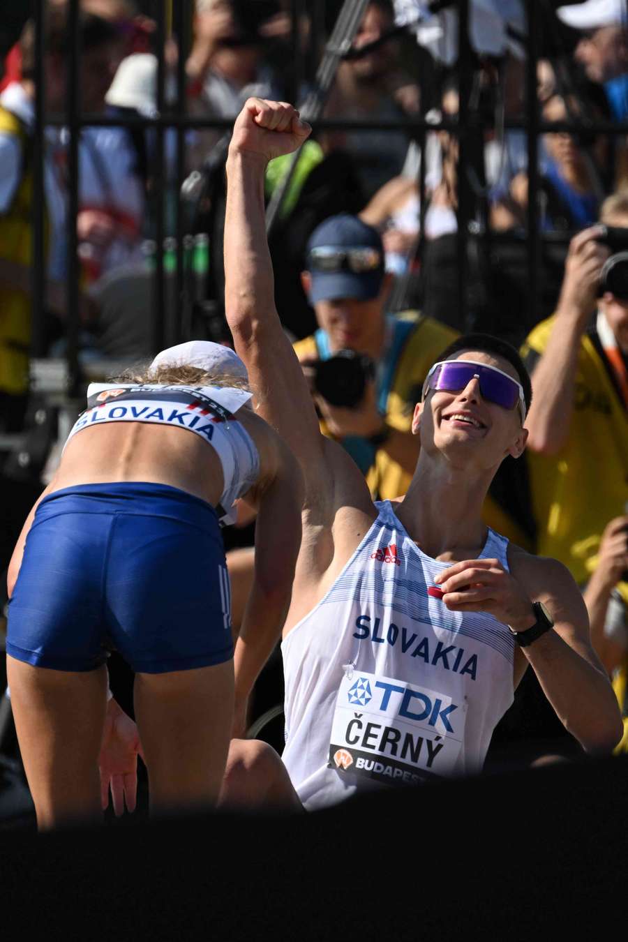 Dominik Cerny raises his arm in the air as the crowd cheered