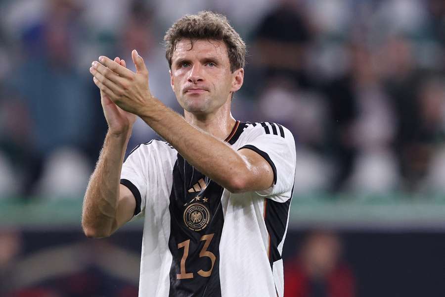 Germany's midfielder #13 Thomas Mueller applauds after the friendly football match between Germany and Japan