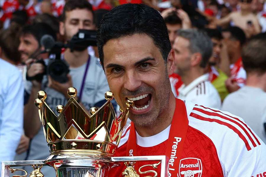 Arsenal manager Mikel Arteta celebrates with the trophy after winning the Premier League Arsenal manager Mikel Arteta celebrates with the trophy after winning the Premier League