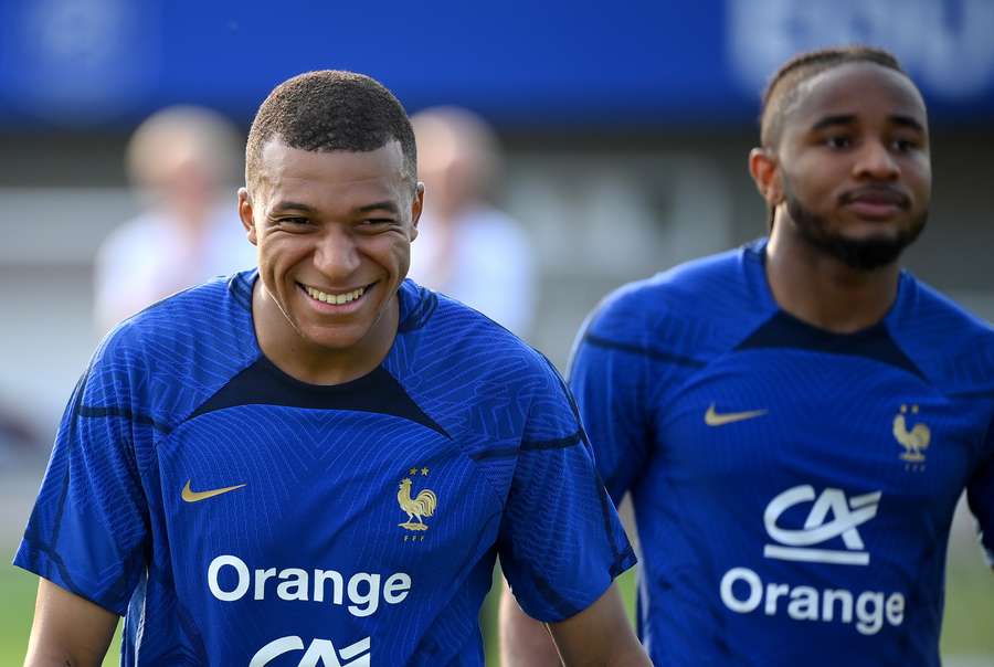 France forward Kylian Mbappe smiles at the end of a training session