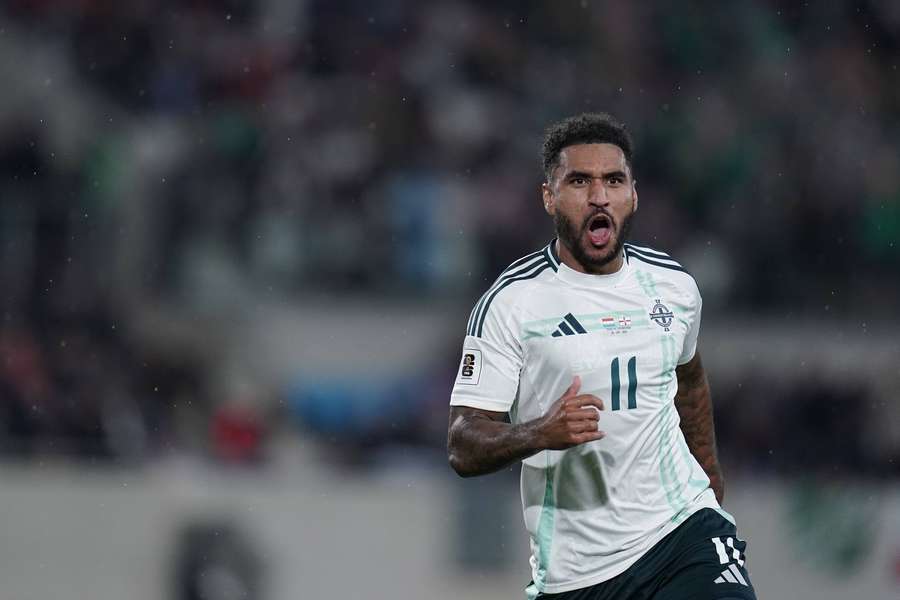 Reid celebrates after scoring for Northern Ireland