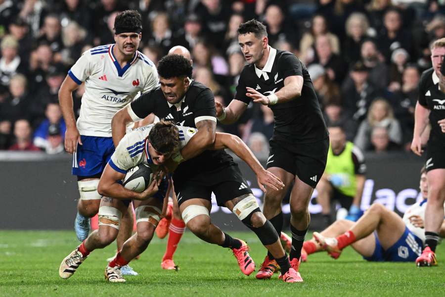 France's Oscar Jegou is tackled by New Zealand's Ardie Savea France's Oscar Jegou is tackled by New Zealand's Ardie Savea