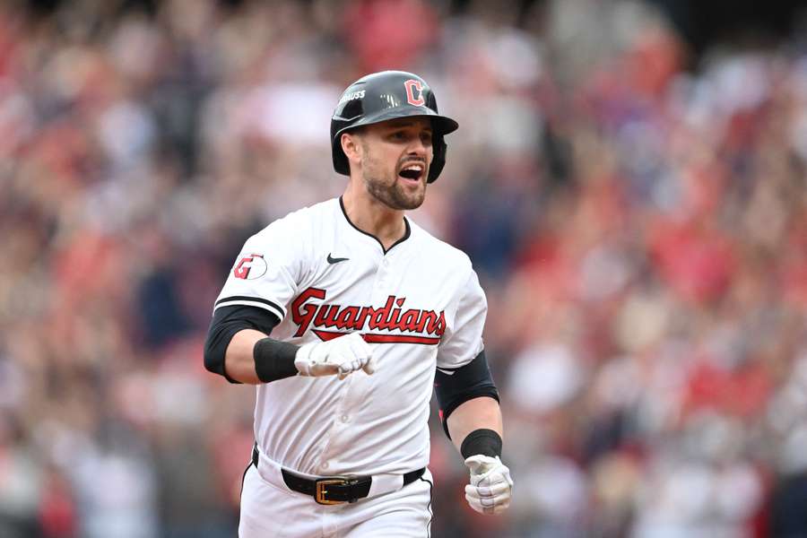 Lane Thomas of the Cleveland Guardians celebrates a grand slam during the fifth inning against the Detroit Tigers