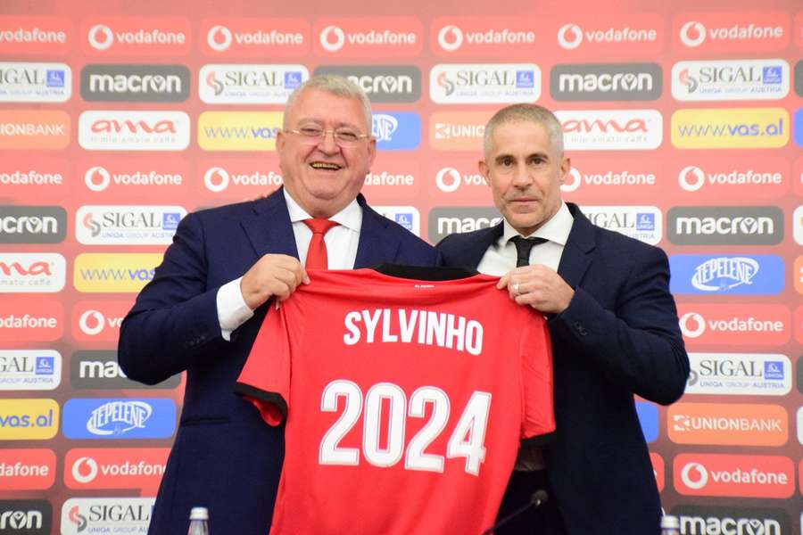 Armand Duka posing with Albania's head coach Sylvinho