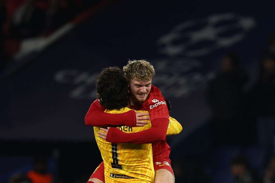 Harvey Elliot hugs Alisson Becker after his heroics