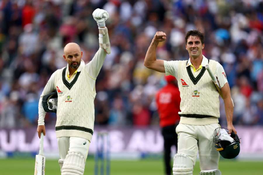 Lyon and Cummins celebrate their win