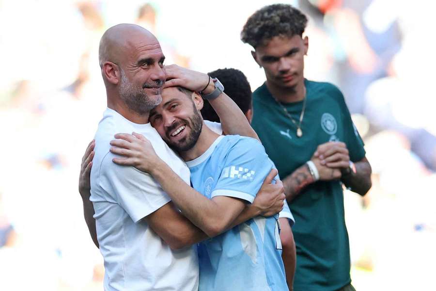 Departing Manchester City manager Pep Guardiola with Bernardo Silva Departing Manchester City manager Pep Guardiola with Bernardo Silva
