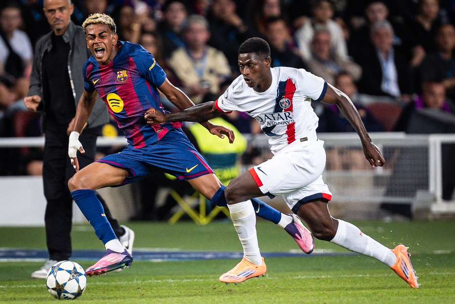 Barcelona's Lamine Yamal is challenged by PSG's Nuno Mendes Barcelona's Lamine Yamal is challenged by PSG's Nuno Mendes