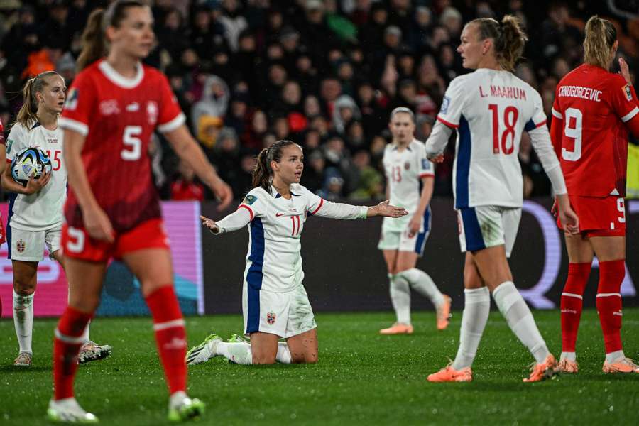 Norway's midfielder #11 Guro Reiten (C) reacts during the match between Switzerland and Norway