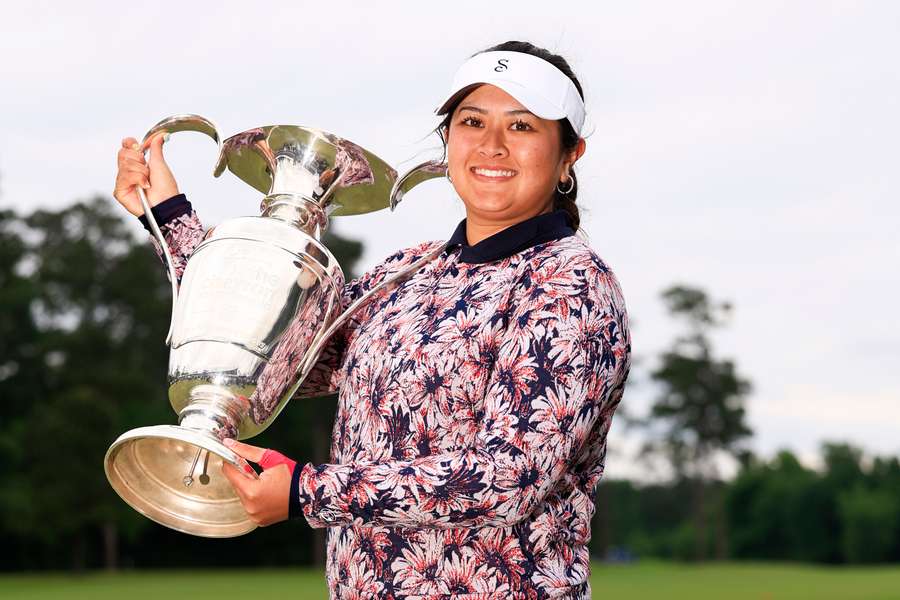 Lilia Vu of the United States celebrates with the trophy