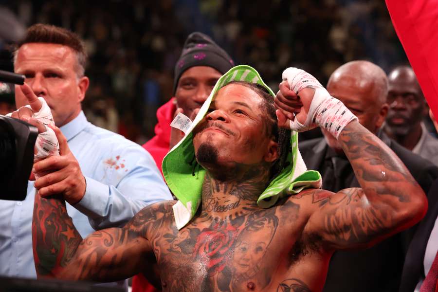 Gervonta Davis in the green and purple trunks reacts after defeating Ryan Garcia