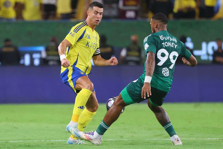 Al Ahli's Ivan Toney presses Al Nassr's Cristiano Ronaldo