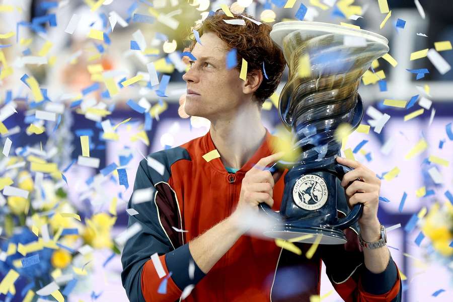 Jannik Sinner poses with the Rookwood Cup after defeating Frances Tiafoe during the men's final of the Cincinnati Open